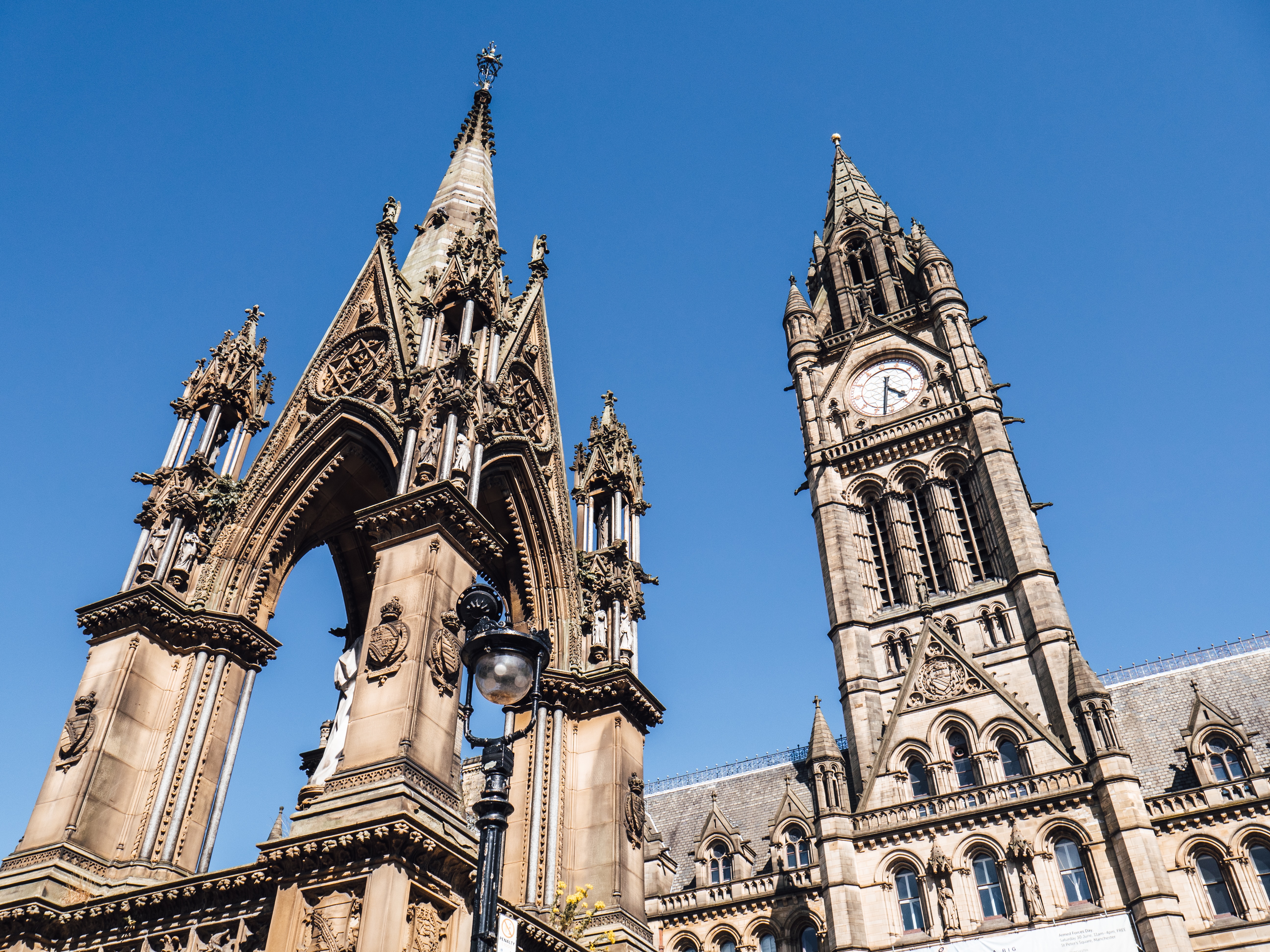 The clock tower of Manchester Town Hall with blue sky