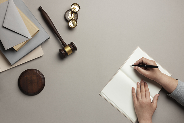 judge hammer, letter, balance, hand writing on notebook
